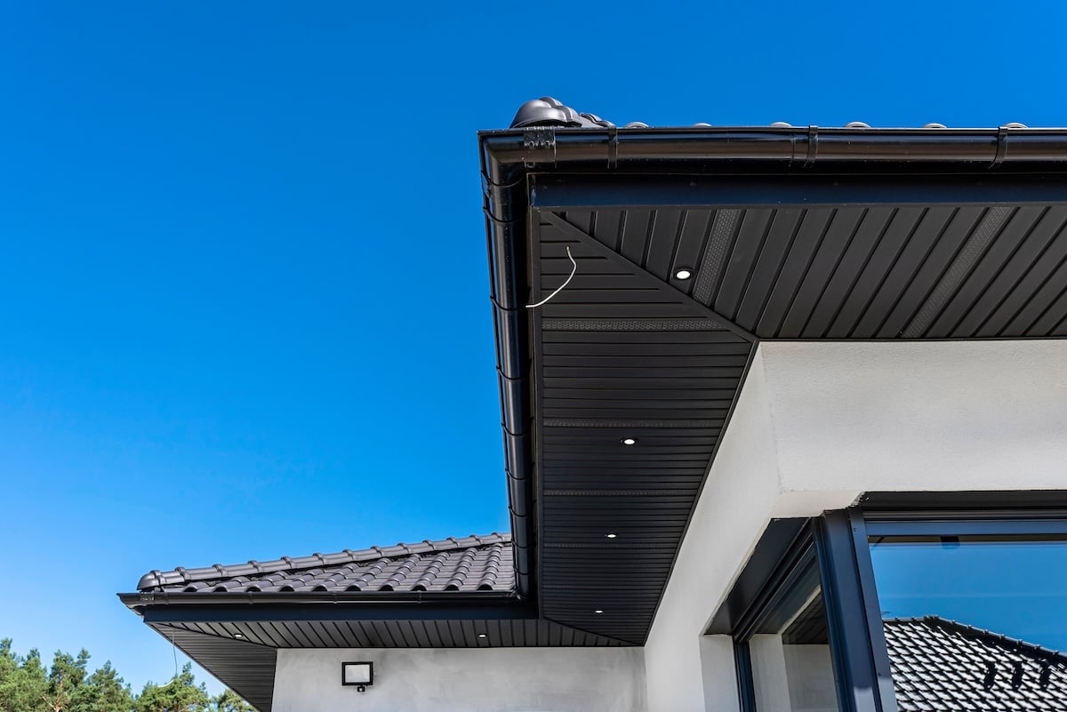 modern metal roof eaves on white house