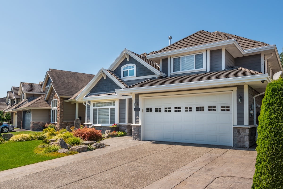 A perfect neighbourhood. Houses in suburb at Summer in the north America. Luxury houses with nice landscape.