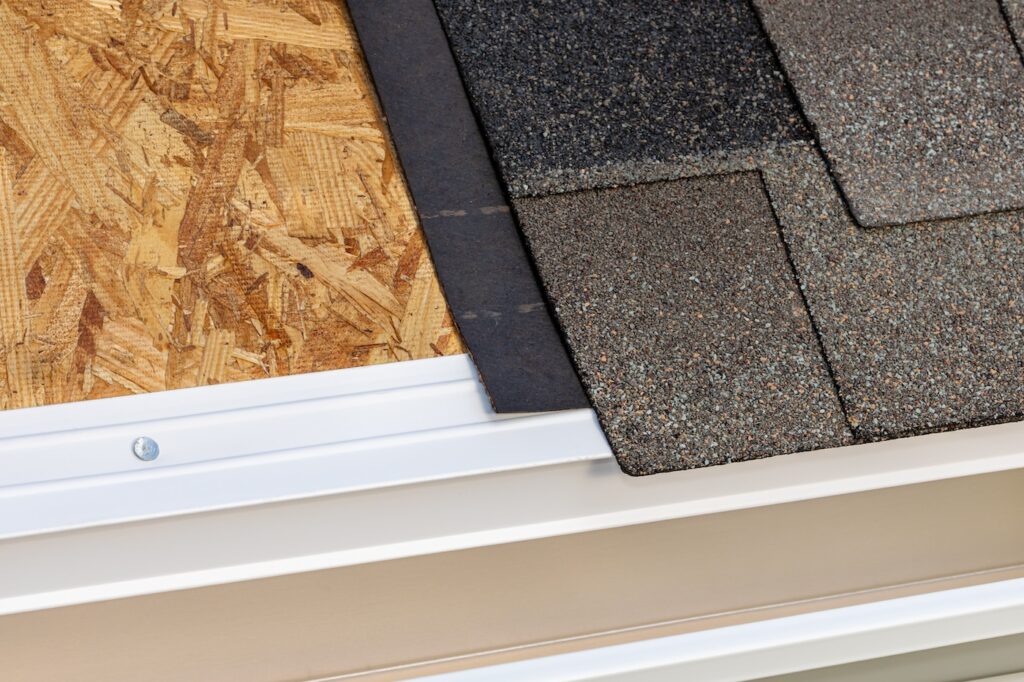 Cutaway view of house roof building materials. Roofing construction, repair and building codes concept.