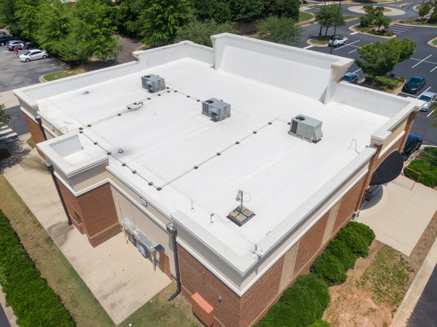 Drone Images of Commercial Roofs Featuring TPO and Asphalt Shingles: Midday, Sunny, No People