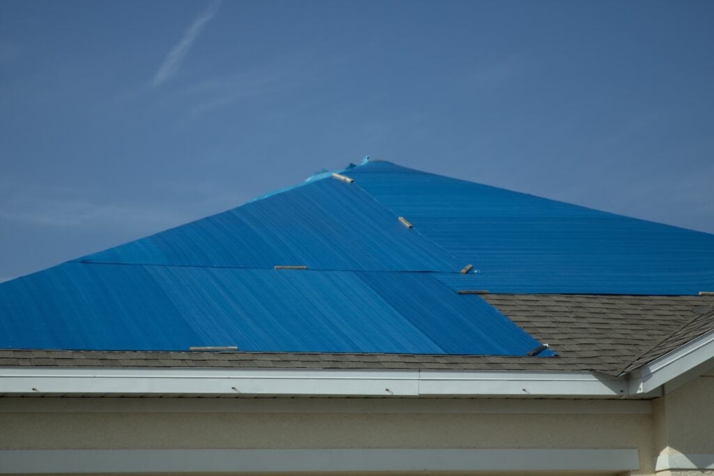Tarp over the roof after hurricane Ian