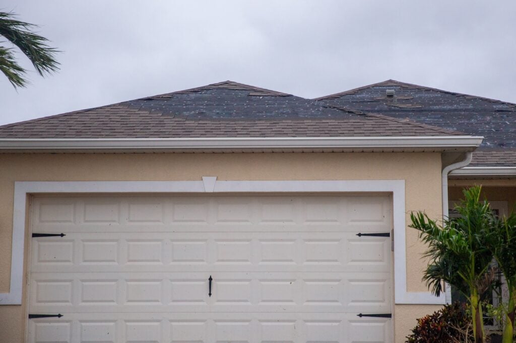 Shingles ripped off a roof after a severe storm