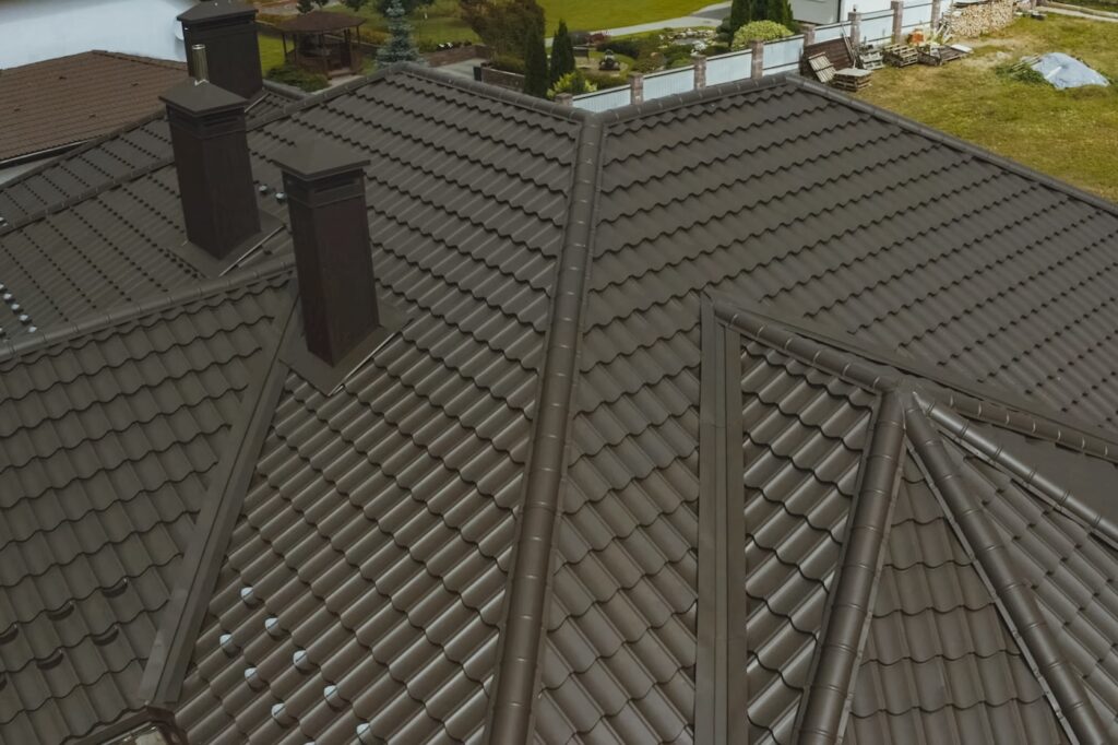 Modern roof made of metal. Corrugated metal roof and metal roofing.