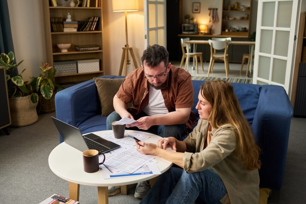 couple looking at roof documents
