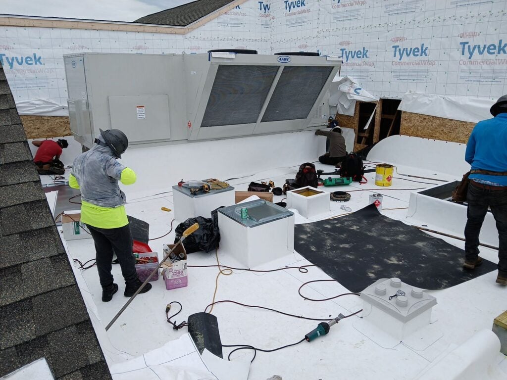 Buckeye state roofing workers on flat commercial roof