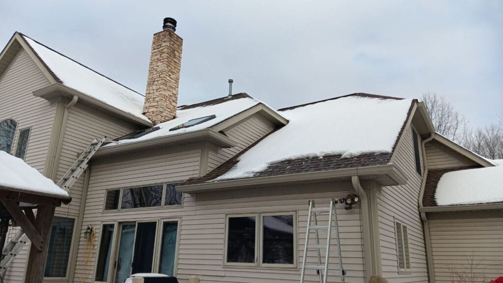 ice dam removal Buckeye Roofing snow on top of roof