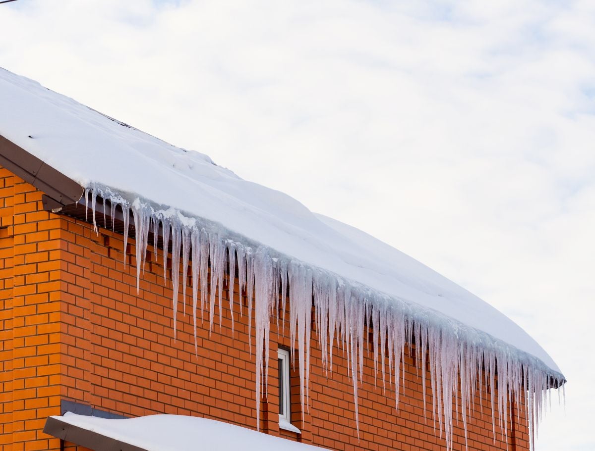 ice dam removal cost orange brick wall