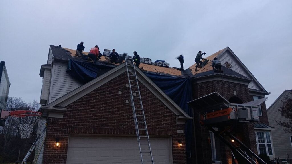 ice dam removal north olmsted oh workers repairing shingles on roof