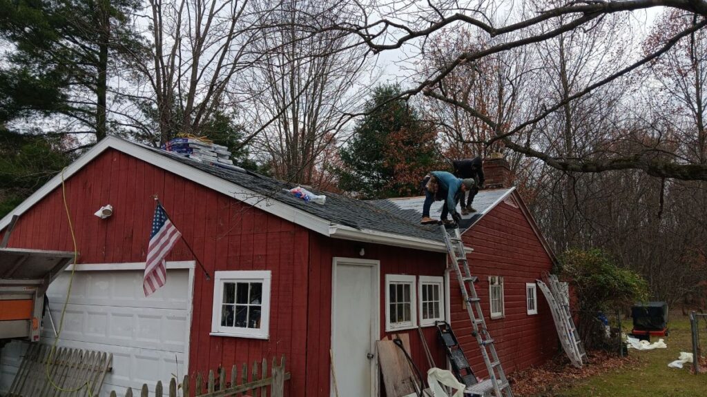 ice dam removal parma heights oh worker removing old shingles
