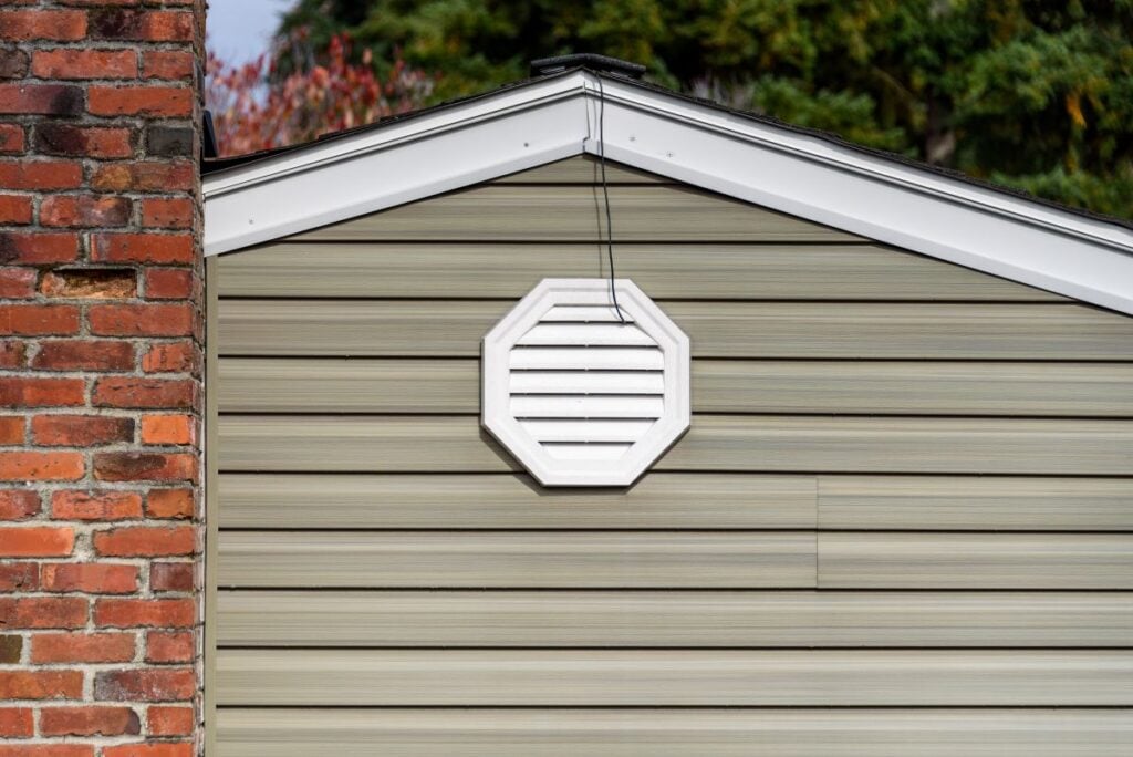 attic fan exhaust vent on wall