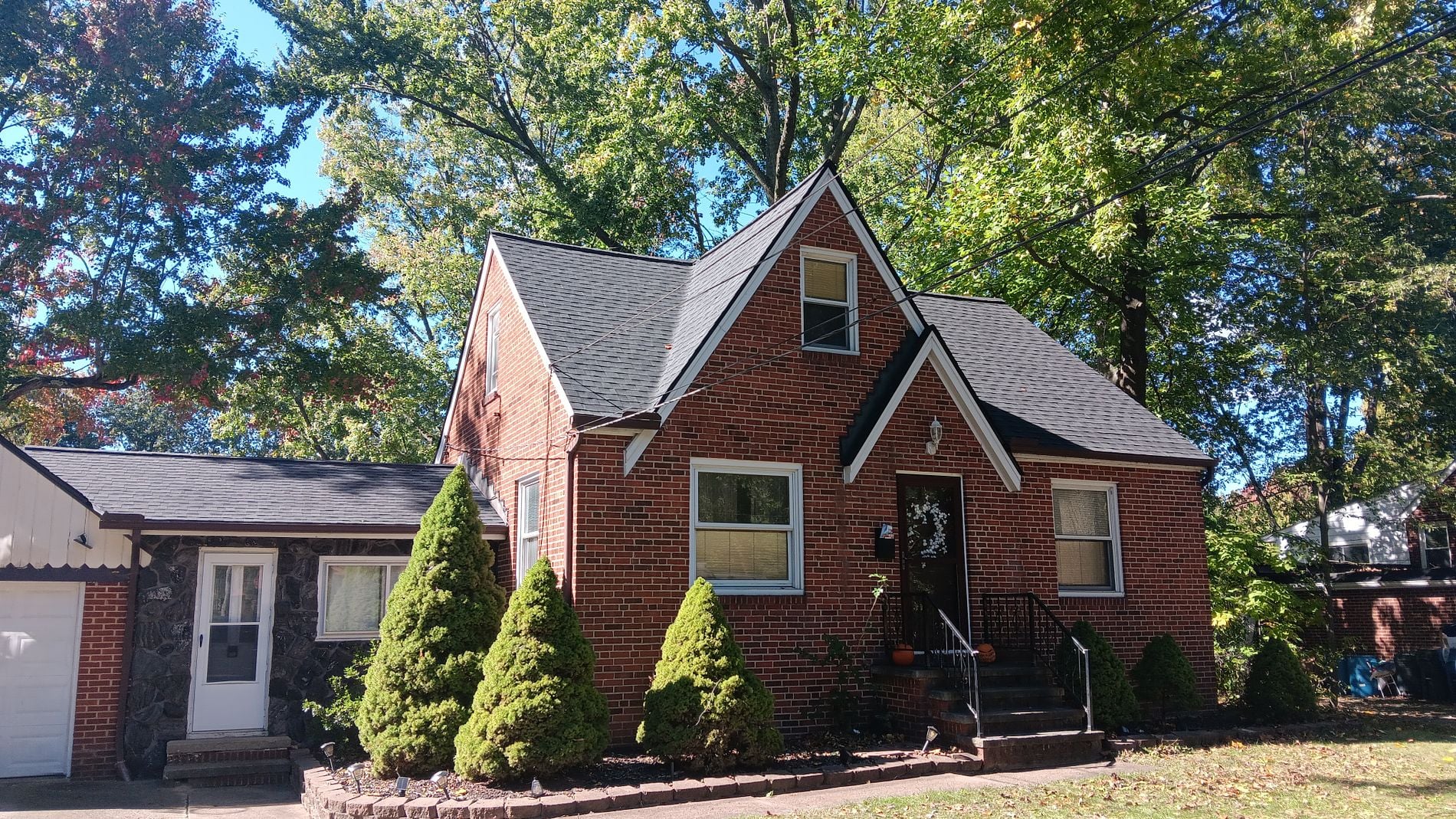 Brick house with a shingle roof