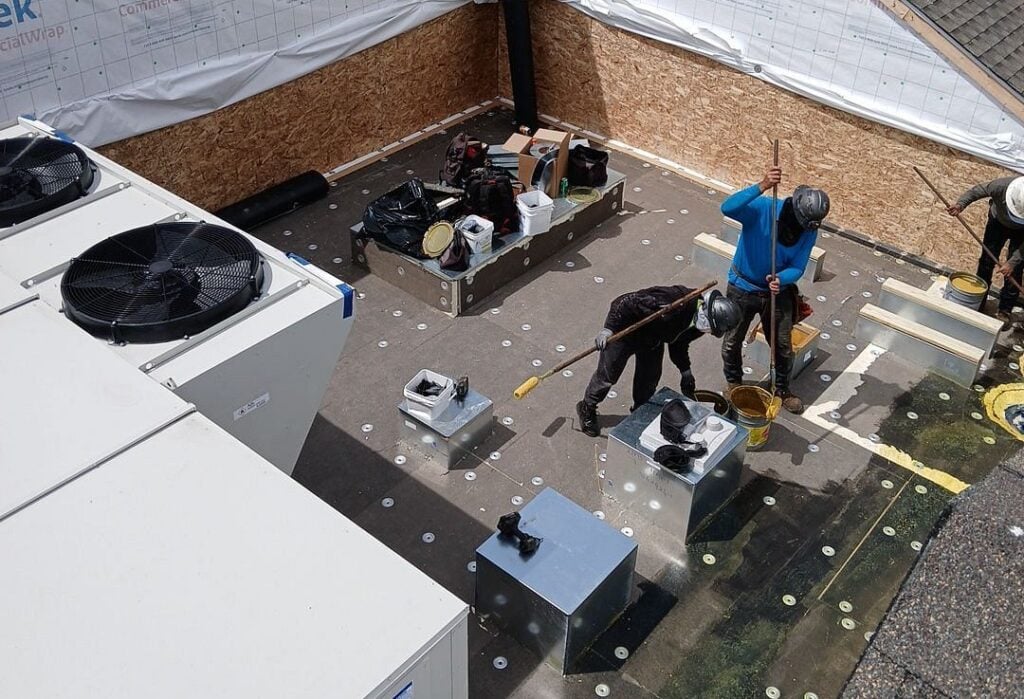 Buckeye State Roofing team replacing a flat roof